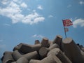 communist flag floating in the wind blue sky background, Pozhikkara beach Kollam Kerala