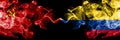 Communist vs Colombia, Colombian abstract smoky mystic flags placed side by side. Thick colored silky smoke flags of Communism and