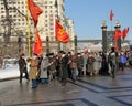 Communists assign flowers to a tomb of the Unknown