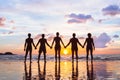 Community or group concept, silhouettes of people standing together and holding hands, team