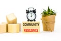 Community resilience symbol. Concept word Community resilience typed on wooden blocks. Beautiful white table white background. Royalty Free Stock Photo