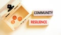 Community resilience symbol. Concept word Community resilience on wooden blocks. Beautiful white table white background. Wooden Royalty Free Stock Photo