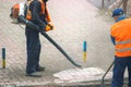community service workers clean the sidewalk