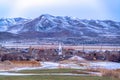 Community in the snow dusted valley with scenic lake and majestic mountain view Royalty Free Stock Photo