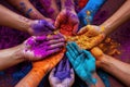 Community spirit shown through hands painted in the rainbow shades of Holi.