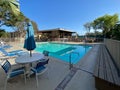 Community swimming pool and jacuzzi inside typical private condo complex. Royalty Free Stock Photo