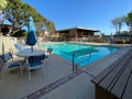 Community swimming pool and jacuzzi inside typical private condo complex. Royalty Free Stock Photo