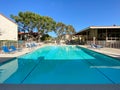 Community swimming pool and jacuzzi inside typical private condo complex. Royalty Free Stock Photo