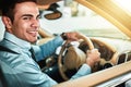 The daily commute. Portrait of a young businessman driving a car. Royalty Free Stock Photo