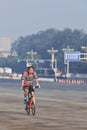 Commuter on a bike in the early morning, Beijing, China.