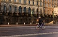 Cyclists on wet road commuting environmentally friendly way