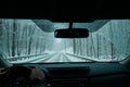 A commuter driving in a winter snow storm