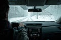 A commuter driving in a winter snow storm Royalty Free Stock Photo