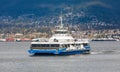 A commuter ferry crosses Vancouver`s Burrard Inlet from North Vancouver. A popular form of transit in Vancouver BC