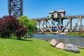 Metra Train Crossing a Railroad Bridge over the Chicago River seen from Ping Tom Memorial Park in Chinatown Chicago