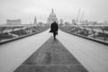 Commuter on Millennium Bridge in London