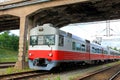 Commuter Train Under Bridge Royalty Free Stock Photo