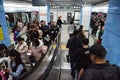People arrive and depart on a platform, Shenzhen subway transport system underground station