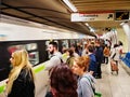 Commuters and Athens Metro Train at Underground Station Platform Station, Greece