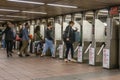 Commuters going through the turnstiles in a subway station in New York City Royalty Free Stock Photo