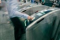 Commuters or passengers going through turnstile in subway, Mass Rapid Transit system in Singapore