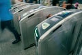 Commuters or passengers going through turnstile in subway, Mass Rapid Transit system in Singapore Royalty Free Stock Photo