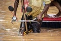 Commuters on a rickshaw to cross a waterlogged road after heavy rainfall, on October 6, 2023 in Guwahati, Assam, India. Severe wat