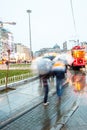 Commuters rush to a tram