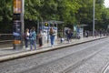 Commuters and tourists waiting for a Luas tram in Dublin City