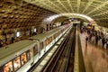 Commuters wait for a train in a Washington DC subway station.