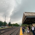 Commuters wait at the Villa Park, IL metra trian station while a heavy storm system begins to arrive