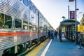 Commuters waiting on the platform to take the Caltrain towards San Francisco