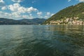 Como, ITALY - August 4, 2019: Apartments, villas, hotels on the green forested mountainsides near Lake Como. Beautiful Italian Royalty Free Stock Photo