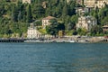 Como, ITALY - August 4, 2019: Apartments, villas, hotels on the green forested mountainsides near Lake Como. Beautiful Italian Royalty Free Stock Photo