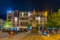 COMO, ITALY, JULY 17, 2019: Night view of people strolling on Piazza Alessandro Volta in Italian town Como