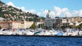 COMO, ITALY - SEPTEMBER 12, 2017: A scenic Italian village at bank of big mountain lake with ships moored, Como, Italy Royalty Free Stock Photo