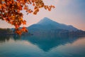 Como lake in Italy, beautiful fall time, red leaves and alp mountains Royalty Free Stock Photo