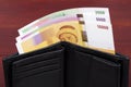 Comorian money in black wallet