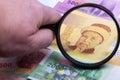 Comorian money in a magnifying glass Royalty Free Stock Photo