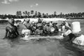 Comorian women are forming a circle to catch the fishes at Galawa Beach