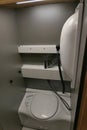 Compact bathroom with sideway folding sink installed in modern german pick up camper van box Tischer Trail 250