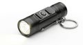 Compact black keychain flashlight with bright led light ideal for everyday carry Royalty Free Stock Photo