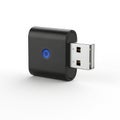 Compact black usb bluetooth adapter with blue indicator light Royalty Free Stock Photo