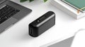 Compact black USB-C power adapter on a desk Royalty Free Stock Photo