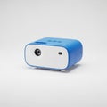 Compact blue and white portable mini projector Royalty Free Stock Photo