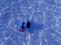 Compact camera and housing floating on the sea.