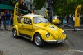 A compact car VW Beetle in the color ADAC