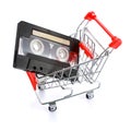 Compact casette in shopping cart isolated