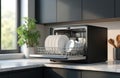 Compact countertop dishwasher, perfect small space solution. Modern, efficient design. Clean white dishes inside. Kitchen tech. Royalty Free Stock Photo