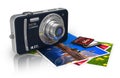 Compact digital camera and photos Royalty Free Stock Photo